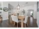 Open dining room with hardwood floors that flows into the living room at 2182 Trevor Rd, Palm Harbor, FL 34683