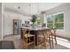 Modern kitchen featuring a central island with bar stools, stainless steel appliances, and ample cabinet space at 2182 Trevor Rd, Palm Harbor, FL 34683
