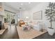 Well-lit living room featuring hardwood flooring, a fireplace, and sliding glass doors at 2182 Trevor Rd, Palm Harbor, FL 34683