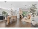 Open-concept living space featuring modern decor, fireplace, and seamless transition to dining and kitchen areas at 2182 Trevor Rd, Palm Harbor, FL 34683