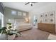 Inviting main bedroom featuring neutral colors and seamless access to an ensuite bath at 2182 Trevor Rd, Palm Harbor, FL 34683
