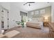 Serene bedroom featuring neutral tones, plush carpet, and a door leading to the outdoor area at 2182 Trevor Rd, Palm Harbor, FL 34683