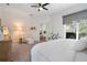 Relaxing bedroom showcasing an adjacent sitting area and an exterior door to the outside at 2182 Trevor Rd, Palm Harbor, FL 34683