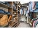Organized walk-in closet featuring custom shelving, drawers, and ample hanging space for clothes and accessories at 2182 Trevor Rd, Palm Harbor, FL 34683