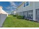 Townhouse backyard with a screened in patio and lush green space at 2507 Arbor Wind Dr, Lutz, FL 33558