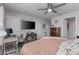 Spacious bedroom with ceiling fan, TV, desk, and stylish furniture at 2507 Arbor Wind Dr, Lutz, FL 33558