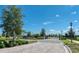 Well landscaped entrance to the community on a sunny day at 2507 Arbor Wind Dr, Lutz, FL 33558