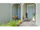 Inviting entrance with outdoor seating and a light blue front door at 2507 Arbor Wind Dr, Lutz, FL 33558