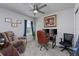Comfortable home office space with desk, multiple chairs, and natural light at 2507 Arbor Wind Dr, Lutz, FL 33558
