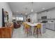 Bright, open kitchen featuring a large island, stainless steel appliances, and a view of the living area at 2507 Arbor Wind Dr, Lutz, FL 33558