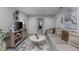 Cozy upstairs living room with modern decor, a flat-screen TV, and comfortable seating at 2507 Arbor Wind Dr, Lutz, FL 33558