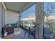 A cozy patio with a table and chairs, perfect for outdoor dining and relaxation at 2507 Arbor Wind Dr, Lutz, FL 33558