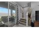 Cozy patio view from staircase landing featuring neutral decor, a flat screen TV, and backyard view at 2507 Arbor Wind Dr, Lutz, FL 33558