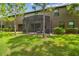 Beautiful backyard featuring a screened patio at 28568 Tranquil Lake Cir, Wesley Chapel, FL 33543