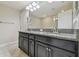 Spacious bathroom featuring dual sinks and granite countertops at 28568 Tranquil Lake Cir, Wesley Chapel, FL 33543