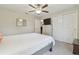 Bright bedroom with a mirrored closet and ceiling fan at 28568 Tranquil Lake Cir, Wesley Chapel, FL 33543