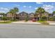 Charming two-story townhomes boast manicured lawns, brick driveways, and inviting curb appeal at 28568 Tranquil Lake Cir, Wesley Chapel, FL 33543