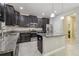 Bright kitchen featuring granite countertops, stainless steel appliances, and ample cabinetry at 28568 Tranquil Lake Cir, Wesley Chapel, FL 33543
