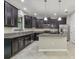 Beautiful kitchen featuring granite countertops, stainless steel appliances, and an island at 28568 Tranquil Lake Cir, Wesley Chapel, FL 33543