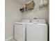 Convenient laundry room with modern washer and dryer at 28568 Tranquil Lake Cir, Wesley Chapel, FL 33543
