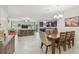 Open concept living space featuring tiled flooring and a smooth transition to the kitchen at 28568 Tranquil Lake Cir, Wesley Chapel, FL 33543