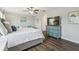 Comfortable main bedroom with a beautiful dresser and wood floors at 28568 Tranquil Lake Cir, Wesley Chapel, FL 33543