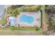 Aerial view of a resort-style pool with ample lounging and shaded seating areas at 28568 Tranquil Lake Cir, Wesley Chapel, FL 33543