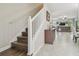 Staircase with wood flooring and a white railing leading to the upper level at 28568 Tranquil Lake Cir, Wesley Chapel, FL 33543