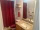 Bright bathroom featuring a granite vanity top, framed mirror, and decorative towels and accessories at 29702 Tee Shot Dr, San Antonio, FL 33576