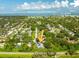 Stunning home aerial view near Belleair Beaches and Country Club, featuring Clearwater Beach on the horizon at 321 Barbara Cir, Belleair, FL 33756