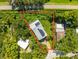 High aerial view of the property shows its lot line and proximity to the Pinellas Trail at 321 Barbara Cir, Belleair, FL 33756