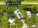 A high aerial view of the property features a lush backyard and proximity to the Pinellas Trail at 321 Barbara Cir, Belleair, FL 33756