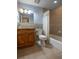 Bright bathroom with a tiled shower and tub combination at 321 Barbara Cir, Belleair, FL 33756