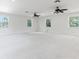 Bright bedroom with a carpeted floor, recessed lighting, and multiple windows at 321 Barbara Cir, Belleair, FL 33756