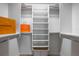 Organized walk-in closet with built-in shelving, providing ample storage space at 321 Barbara Cir, Belleair, FL 33756
