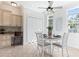 Charming dining area features bright windows and ceiling fan fixture at 321 Barbara Cir, Belleair, FL 33756