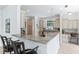 Kitchen with granite countertops, breakfast bar, and stainless steel appliances at 321 Barbara Cir, Belleair, FL 33756