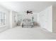 Spacious primary bedroom with neutral tones, plush carpet, and ample natural light at 321 Barbara Cir, Belleair, FL 33756