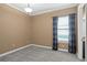 Comfortable bedroom with carpet, window with curtains, and a ceiling light, offering a serene and inviting atmosphere at 3214 Forsythia Dr, Odessa, FL 33556