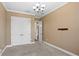 Cozy bedroom featuring neutral carpet, double doors, a ceiling fan, and crown molding, creating a comfortable space at 3214 Forsythia Dr, Odessa, FL 33556