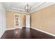 Spacious bedroom featuring a neutral color palette, hardwood floors and ensuite access at 3214 Forsythia Dr, Odessa, FL 33556