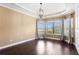 Well lit dining room featuring hardwood floors, modern lighting and large windows for an airy feel at 3214 Forsythia Dr, Odessa, FL 33556