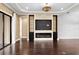 Spacious living room boasting a fireplace, built-in features, and sliding doors to outdoor space at 3214 Forsythia Dr, Odessa, FL 33556