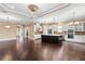 Open floor plan displaying a kitchen with island along with a spacious living area at 3214 Forsythia Dr, Odessa, FL 33556