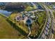 A wide aerial view of the community park with pool, playground and gazebo at 33854 Floating Heart Ct, Wesley Chapel, FL 33545