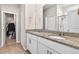 Bathroom featuring a double vanity with granite countertops and a separate walk-in shower at 33854 Floating Heart Ct, Wesley Chapel, FL 33545