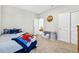 Cozy bedroom with a single bed, closet, and room for a reading chair at 33854 Floating Heart Ct, Wesley Chapel, FL 33545