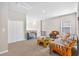 Bright bonus room featuring carpet flooring, and ample storage with access to an upstairs play area at 33854 Floating Heart Ct, Wesley Chapel, FL 33545