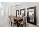 Bright dining area with a modern light fixture and large mirrors at 33854 Floating Heart Ct, Wesley Chapel, FL 33545