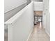 Hallway featuring a view of dining room and plenty of natural light at 33854 Floating Heart Ct, Wesley Chapel, FL 33545